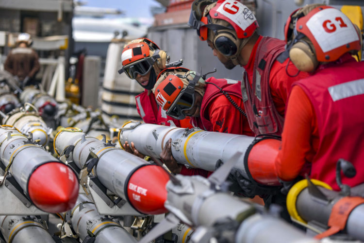 Picture of the Day: US Navy ‘Red Shirt’ Ordnancemen Operating on the USS Harry S. Truman