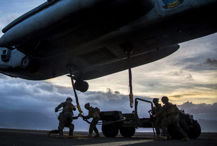 Picture of the Day: Marines Attach a Humvee to a CH-53E Super Stallion