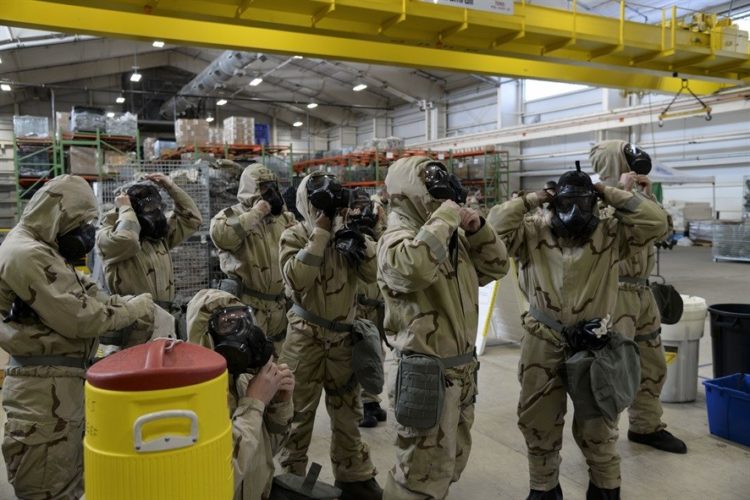 Watch: Airmen from the 12th Aircraft Maintenance Unit assemble a Reaper drone in full MOPP gear