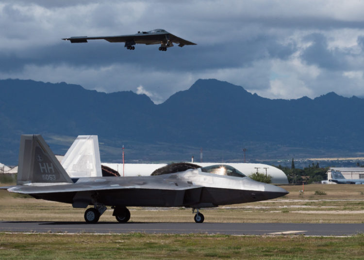 Check out these incredible shots of F-22 Raptors and a B-2 Spirit flying together over Hawaii