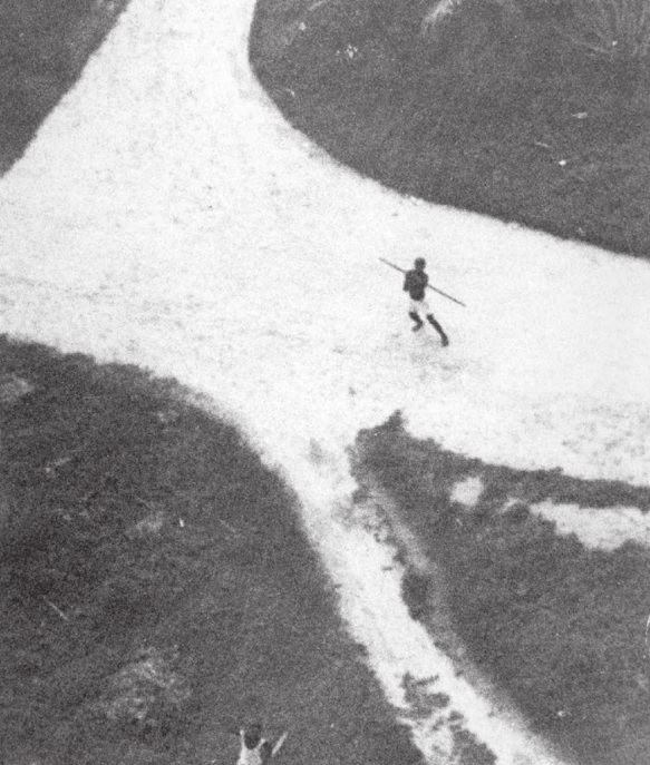 Declassified CIA photo shows African civilian throwing spear at low-flying US recon plane in the '60s