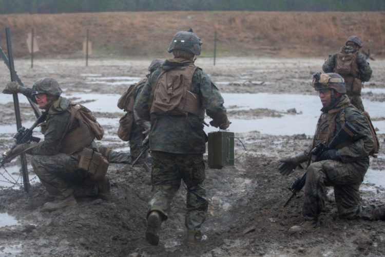 The Pic of the Day: Muddy, tired, but still lethal