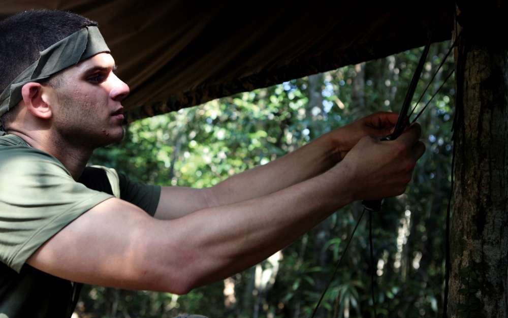 Soldier setting up shelter