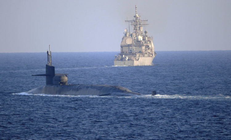 USS Georgia Emerges in the Midst of the Iranian Navy During a Live Torpedo Drill
