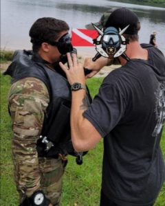 Pre-dive inspections on a Combat Dive Competition participant.