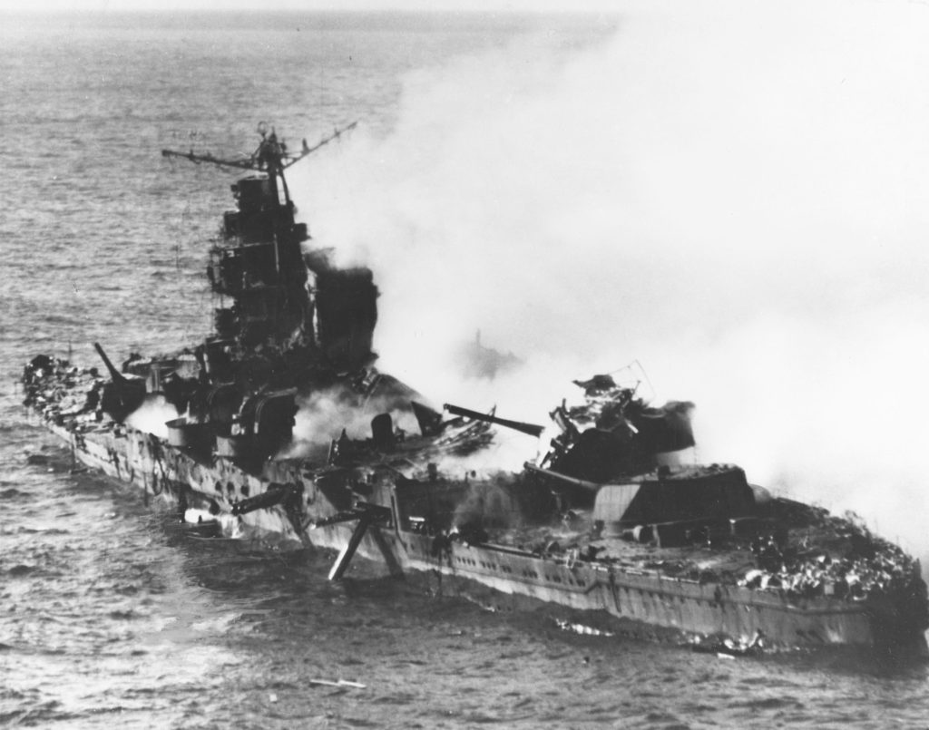Japanese heavy cruiser Mikuna after being devastated by American dive bombers in the Battle of Midway.