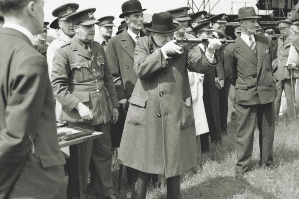 Winston Churchill fires a Sten gun.