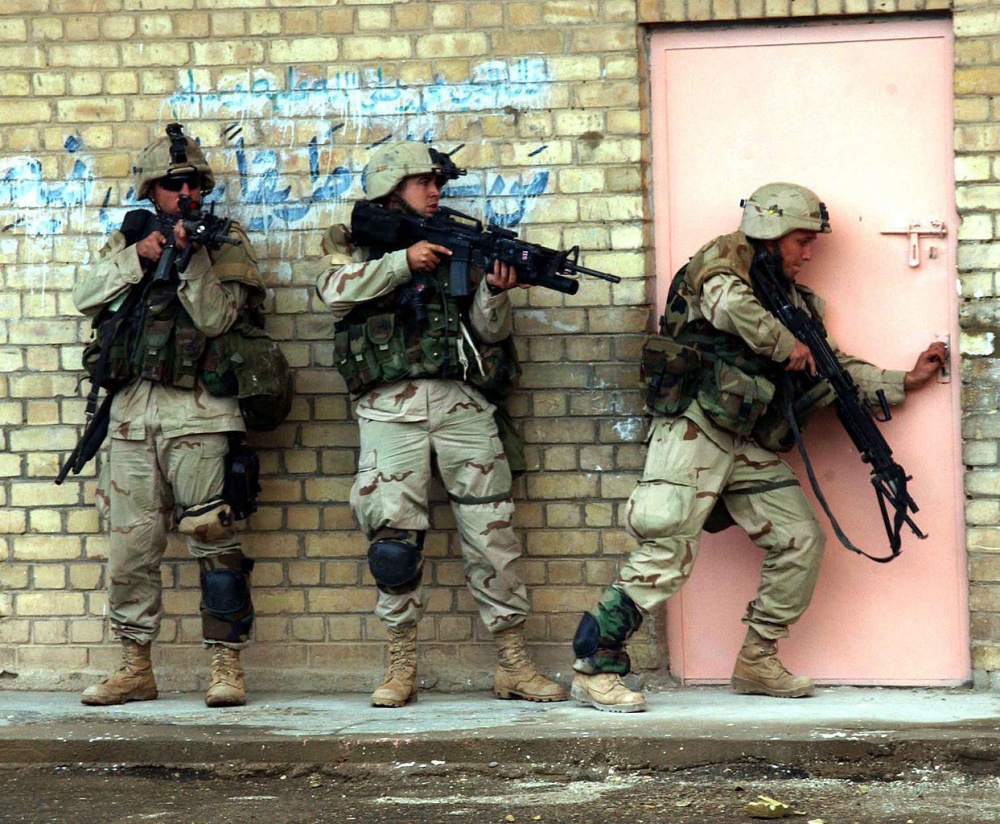 Marines prepare to enter a building in Fallujah