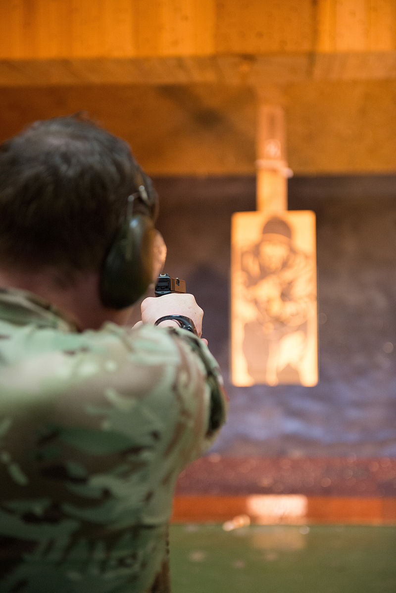 British Military Police Airman Cpl. Stephen Haggarty, assigned at Ramstein Air Base, shoots with his Glock pistol at the U.S. Army Training Support Center Benelux 25-meter indoor range on Chièvres Air Base, Belgium, April 13, 2015. British forces assigned to different units in NATO or SHAPE trained under supervision of the British Joint European Training Team. (U.S. Army photo by Visual Information Specialist Pierre-Etienne Courtejoie / Released)