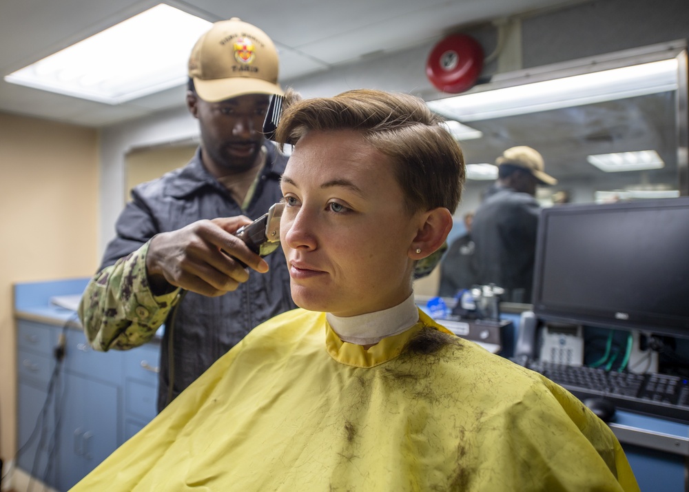 female sailor getting a haircut