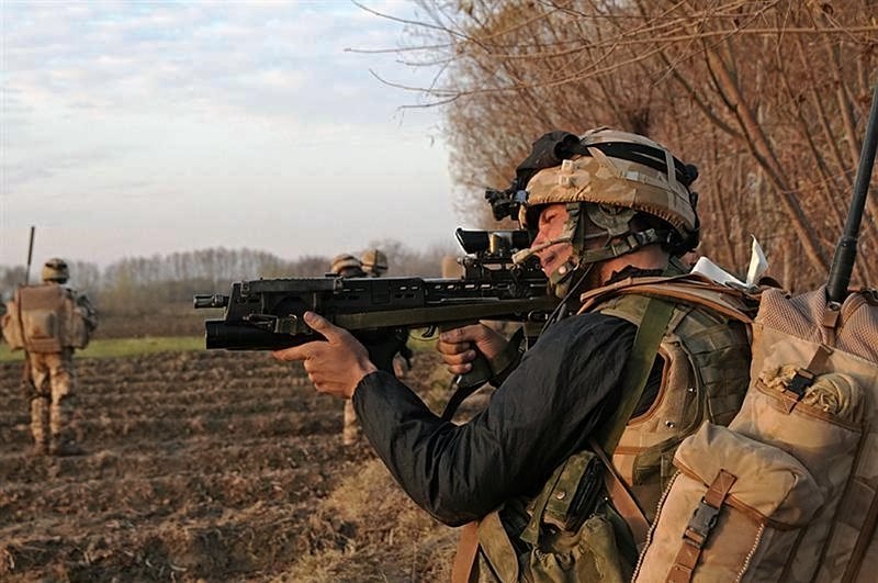 British soldier firing rifle