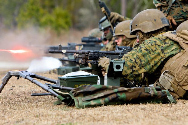 Marines fire machine guns