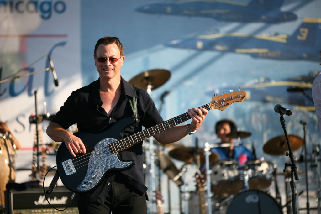 Gary Sinese on Stage with the Lt. Dan Band performing at the Chicago Air and Water Festival in 2008 (Wikimedia Commons). Source: https://commons.wikimedia.org/wiki/File:Gary_Sinise_on_stage_1.jpg