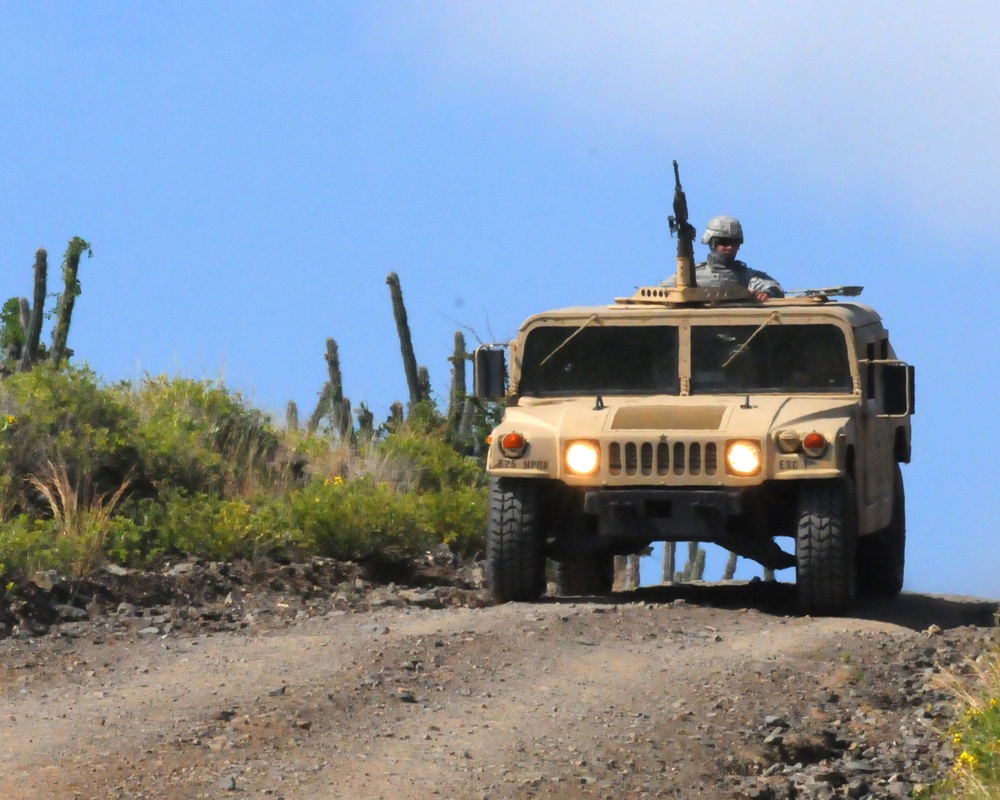 Members of the Company B, 1/296th Infantry Regiment of the Puerto Rico National Guard patrol the perimeter around Joint Task Force Guantanamo with a Humvee, one of the vehicles that can be replaced by an electric version (DVIDS). Source: https://www.dvidshub.net/image/349955/humvee-patrol