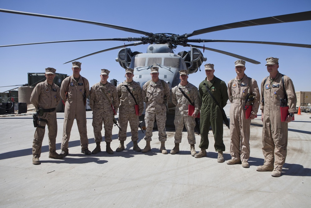 Brig. Gen. Glenn M. Walters stands with the eight awardees from Heavy Marine Helicopter Squadron 461 during an awards ceremony, at Camp Bastion, Afghanistan, March 23 (DVIDS). Source: https://www.dvidshub.net/image/381744/hmh-461-marines-rewarded-extraordinary-lift
