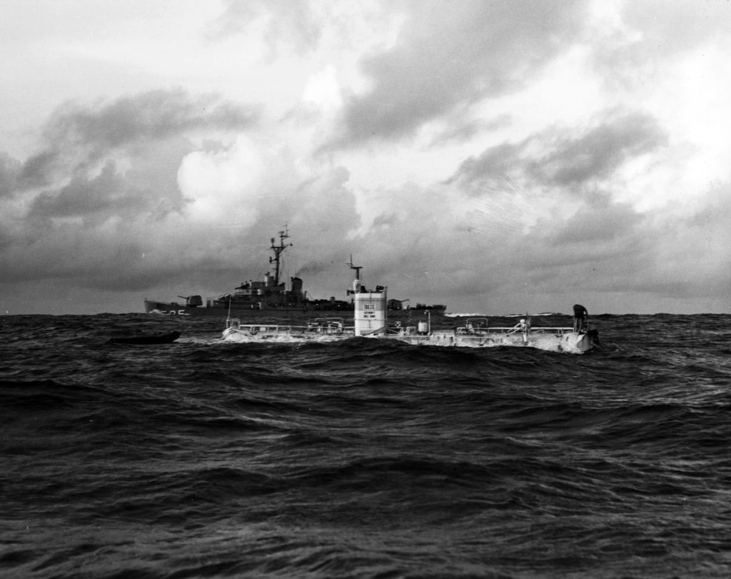 The U.S. Navy bathyscaphe Trieste, just before her record dive to the bottom of the Marianas Trench, 23 January 1960. (Wikimedia Commons). Source: https://commons.wikimedia.org/wiki/File:Bathyscaphe_Trieste_with_USS_Lewis_(DE-535)_over_the_Marianas_Trench_on_23_January_1960_(USN_710619).jpg