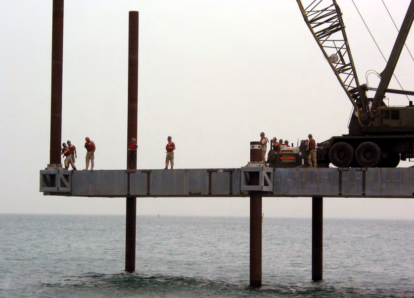 Amphibious Construction Battalion 3 working on a dock (Screen capture from (www.history.navy.mil). Source: https://www.history.navy.mil/content/dam/museums/Seabee/UnitListPages/ACB/ACB%2002.pdf
