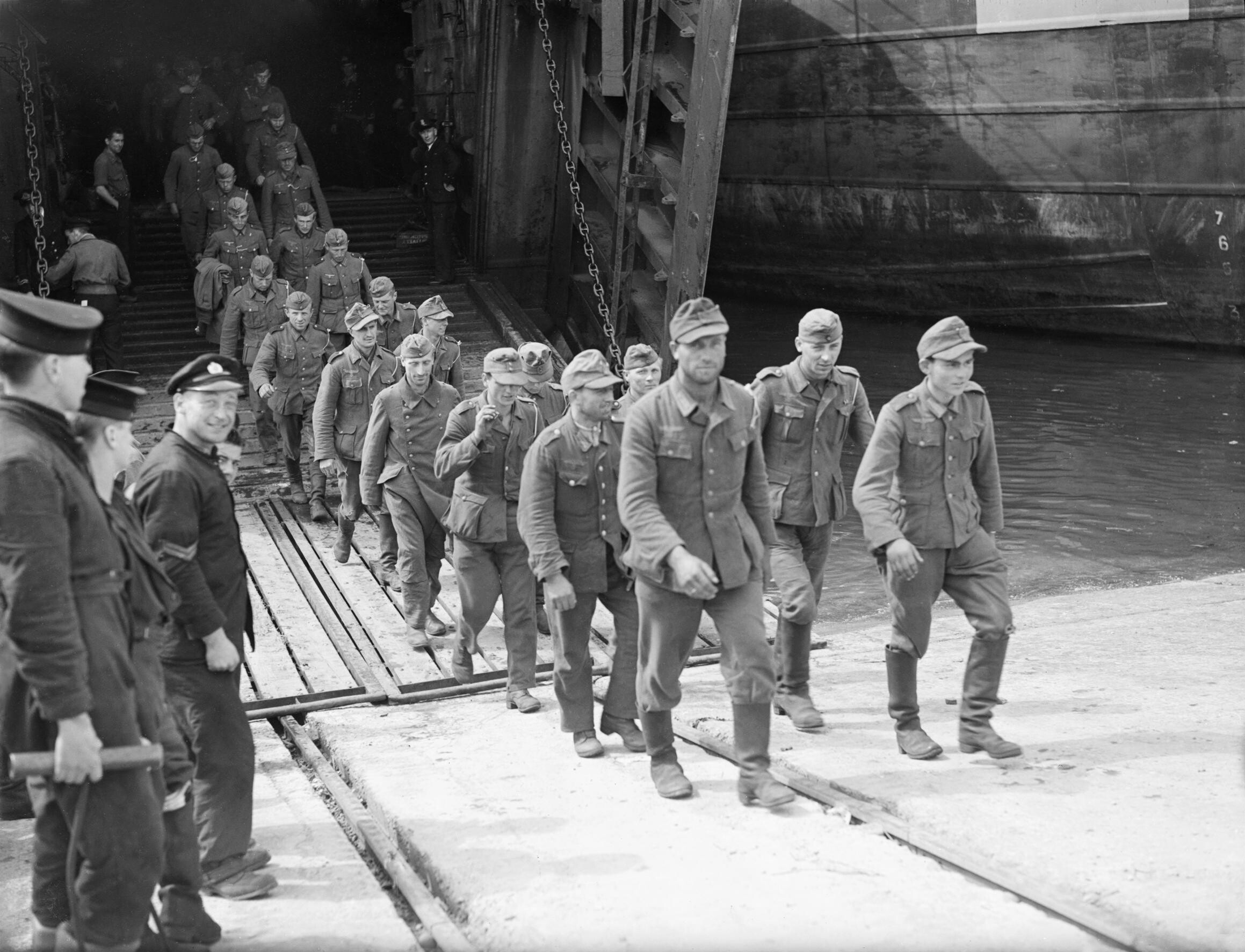 Some of a party of three hundred German prisoners of war from Normandy leaving an LST at Southampton Docks