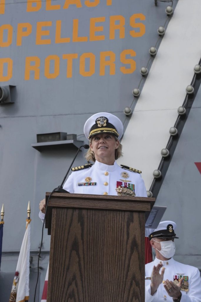 Capt. Amy Bauernschmidt, newly appointed commanding officer of the aircraft carrier USS Abraham Lincoln, delivers remarks during a change of command ceremony held on the flight deck. Capt. Walt "Sarge" Slaughter successfully completed his 26 month tour as commanding officer during which Abraham Lincoln completed a 10-month combat deployment, the largest carrier work package ever completed in San Diego, and returned to sea in preparation for an upcoming deployment amidst the COVID-19 pandemic. Slaughter was relieved by Capt. Amy Bauernschmidt. (DVIDS, U.S. Navy photo by Mass Communication Specialist 3rd Class Jeremiah Bartelt/Released). Source: https://www.dvidshub.net/image/6794630/uss-abraham-lincoln-cvn-72-change-command