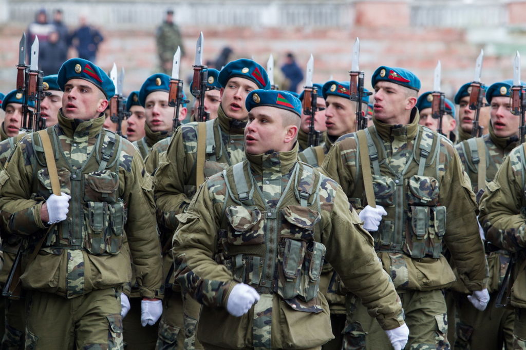 Transnistrian paratroopers, military-sports festival, Tiraspol capital city stadium, 20 February 2016 ("All materials from Transnistrian Government site may be reproduced in any media, on the Internet server or in any other media without any restrictions on the amount and time of publication. This permission applies equally to newspapers, magazines, radio stations, TV channels, websites and web pages. The only condition of reprinting and reproduction is a reference to the source. No prior permission to reprint from the Office of the Government of the PMR is required."http://gov-pmr.org/rules Retrieved 19 February 2016Attribution, Attribution, via Wikimedia Commons). Source: https://commons.wikimedia.org/wiki/File:Transnistrian_infantry.JPG
