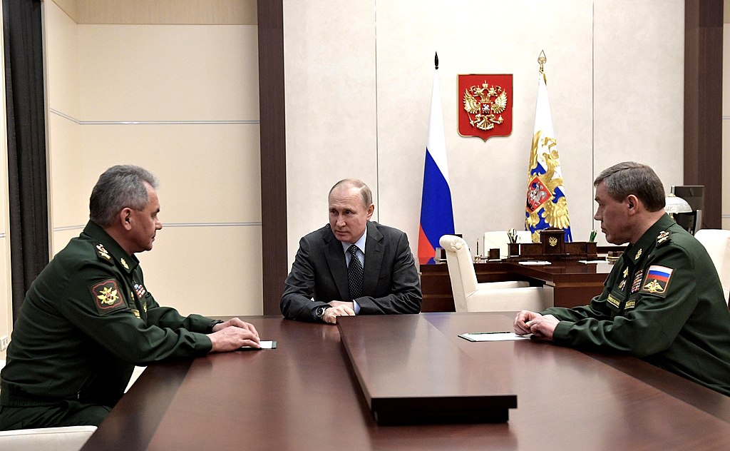 Meeting of Russian President Vladimir Putin with Defense Minister Sergei Shoigu and Chief of the General Staff of the Armed Forces - First Deputy Defense Minister Valery Gerasimov (Kremlin.ru, CC BY 4.0 , via Wikimedia Commons). Source: https://commons.wikimedia.org/wiki/File:Vladimir_Putin,_Sergey_Shoigu,_Valery_Gerasimov_(2018-04-20).jpg