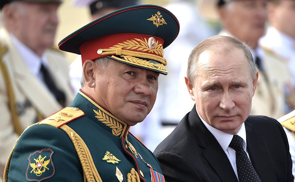Vladimir Putin and Sergei Shoigu at Navy Parade. Saint Petersburg, 30 July 2017 (Kremlin.ru, CC BY 4.0 , via Wikimedia Commons). Source: https://commons.wikimedia.org/wiki/File:Vladimir_Putin_and_Sergey_Shoigu_-_Saint-Petersburg_2017-07-30_(1).jpg