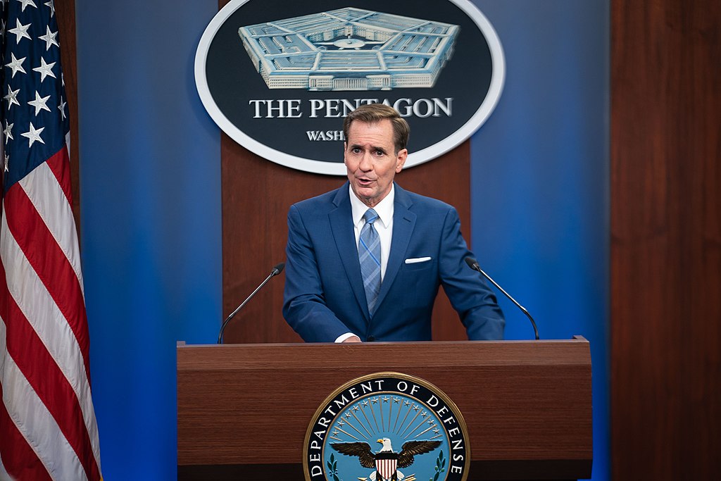 Pentagon Press Secretary John F. Kirby speaks at a press briefing on the Afghanistan withdrawal at the Pentagon, Washington, D.C., Aug. 16, 2021. (Chairman of the Joint Chiefs of Staff from Washington D.C, United States, CC BY 2.0 , via Wikimedia Commons, DOD Photo by Navy Petty Officer 1st Class Carlos M. Vazquez II). Source: https://commons.wikimedia.org/wiki/File:210816-D-WD757-1989_(51384888283).jpg