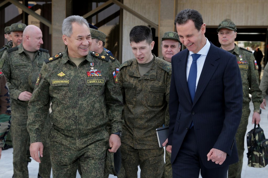 Russian Defense Minister Sergei Shoigu with Syrian President Bashar al-Assad in Damascus (Mil.ru, CC BY 4.0 , via Wikimedia Commons). Source: https://commons.wikimedia.org/wiki/File:Bashar_al-Assad_and_Sergey_Shoigu_(2022-02-15)_04.jpg