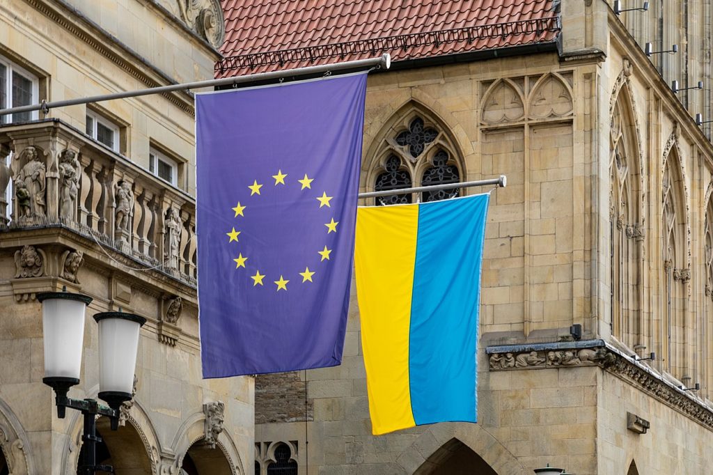 Flags (European Union and Ukraine) at the Stadtweinhaus on Prinzipalmarkt in Münster, North Rhine-Westphalia, Germany