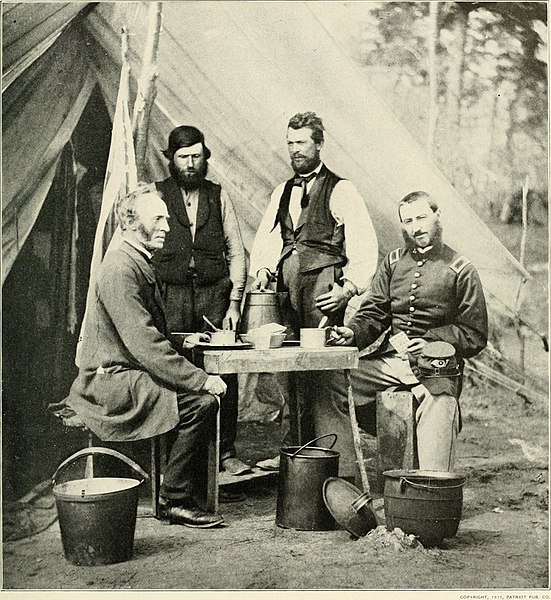 T THE TELEGRAPHERS- TEXT, YORKTOWN—MAY, 1862 These operators with their friends at dinner. (<a href="https://commons.wikimedia.org/wiki/File:The_photographic_history_of_the_Civil_War_-_thousands_of_scenes_photographed_1861-65,_with_text_by_many_special_authorities_(1911)_(14759773101).jpg">Internet Archive Book Images</a>, No restrictions, via Wikimedia Commons)
