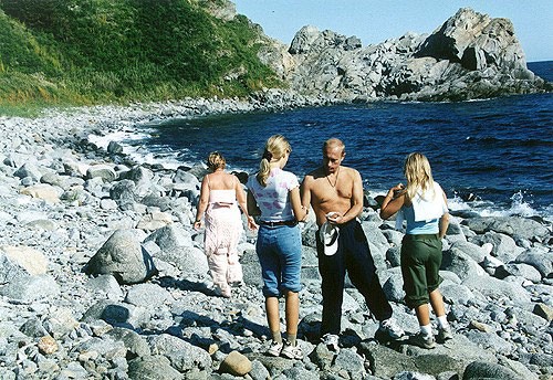 Vladimir Putin with family on a beach in Primorsky Krai in the Russian Far East in 2002. This is an approved photo released by the Kremlin which intentionally does not show the faces of Vladimir Putin's family.