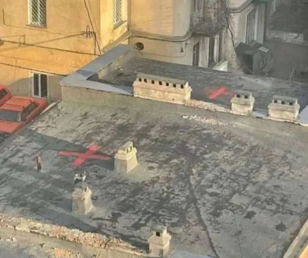 Suspicious markings showed up on Ukrainian buildings that were later destroyed in airstrikes. Image credit: independant.co.uk