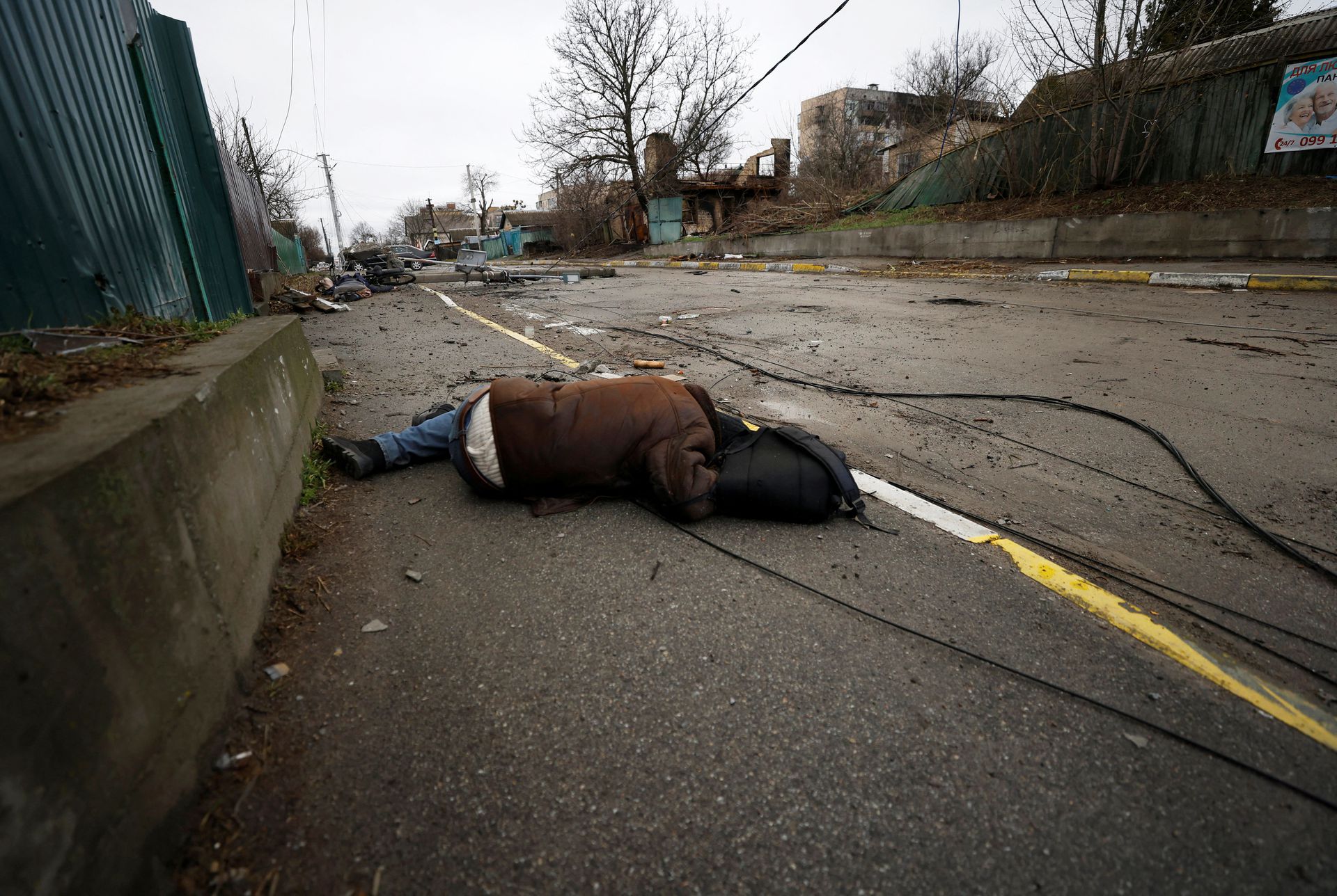 The body of a civilian, who, according to residents, was killed by Russian soldiers lies in the street of Bucha, near Kyiv. Image Credit: Reuters/Zohra Bensemra