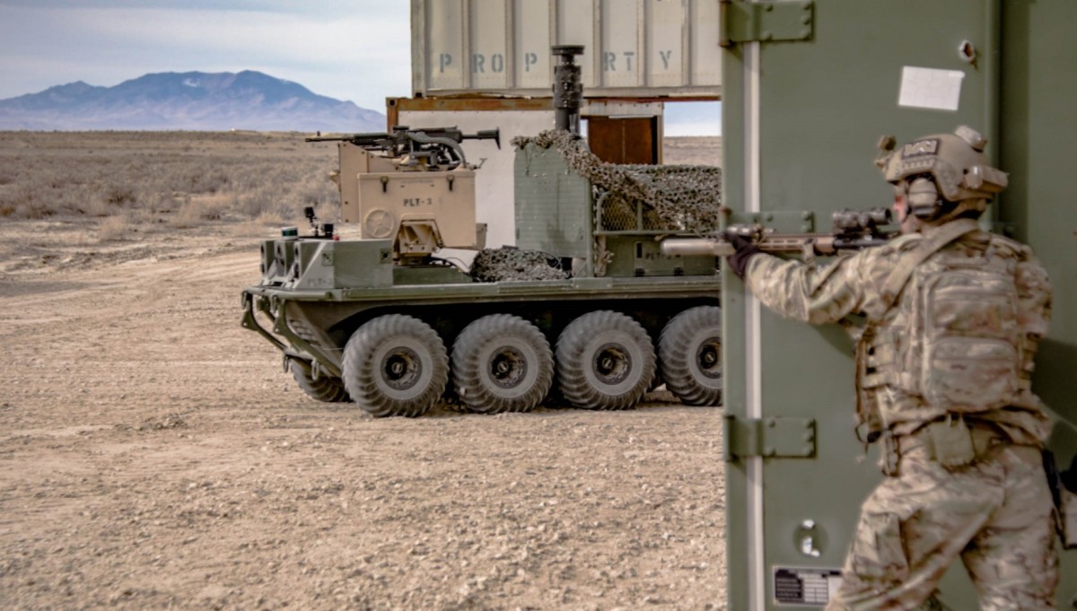 A member of the 1st Special Forces Group interacts with a vehicle from Project Origin Unmanned Systems at Dugway Proving Ground, Utah. US Army photo by VIDS Corp