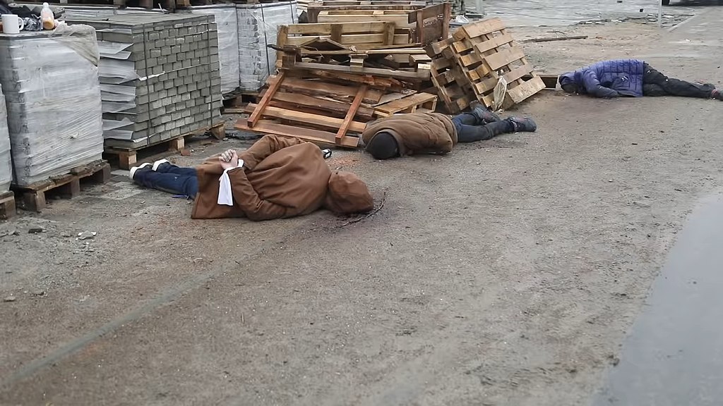 Bucha civilians allegedly killed by Russian troops (Ukrinform TV, CC BY 3.0 <https://creativecommons.org/licenses/by/3.0>, via Wikimedia Commons). Source: https://commons.wikimedia.org/wiki/File:%D0%9C%D1%96%D1%81%D1%82%D0%BE_%D0%91%D1%83%D1%87%D0%B0_%D0%BF%D1%96%D1%81%D0%BB%D1%8F_%D0%B7%D0%B2%D1%96%D0%BB%D1%8C%D0%BD%D0%B5%D0%BD%D0%BD%D1%8F_%D0%B2%D1%96%D0%B4_%D1%80%D0%BE%D1%81%D1%96%D0%B9%D1%81%D1%8C%D0%BA%D0%B8%D1%85_%D0%BE%D0%BA%D1%83%D0%BF%D0%B0%D0%BD%D1%82%D1%96%D0%B2_01.jpg