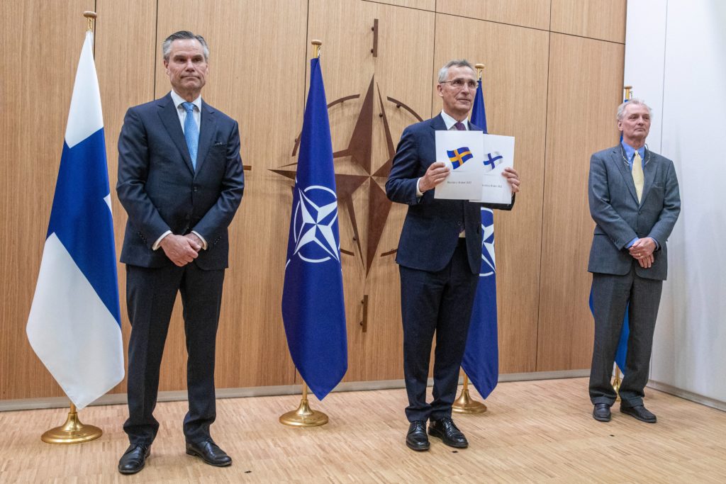 Finnish Ambassador Klaus Korhonen, NATO Secretary General Jens Stoltenberg and Swedish Ambassador Axel Wernhoff submitting their respective country's application to NATO (Finland at NATO). Source: https://twitter.com/FinMissionNATO/status/1526893945522950144