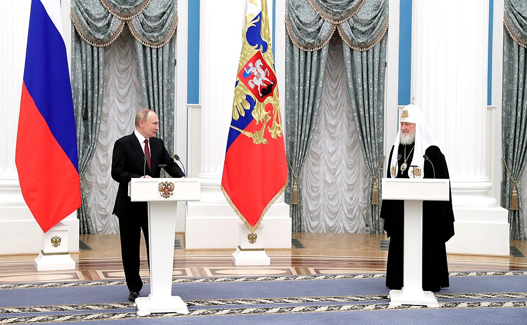 Russian President Vladimir Putin with Patriarch Kirill of Moscow, during a ceremony in awarding him with the Order of St Andrew the Apostle the First (Kremlin.ru, CC BY 4.0 , via Wikimedia Commons). Source: https://commons.wikimedia.org/wiki/File:Putin_with_Patriarch_Kirill.jpg