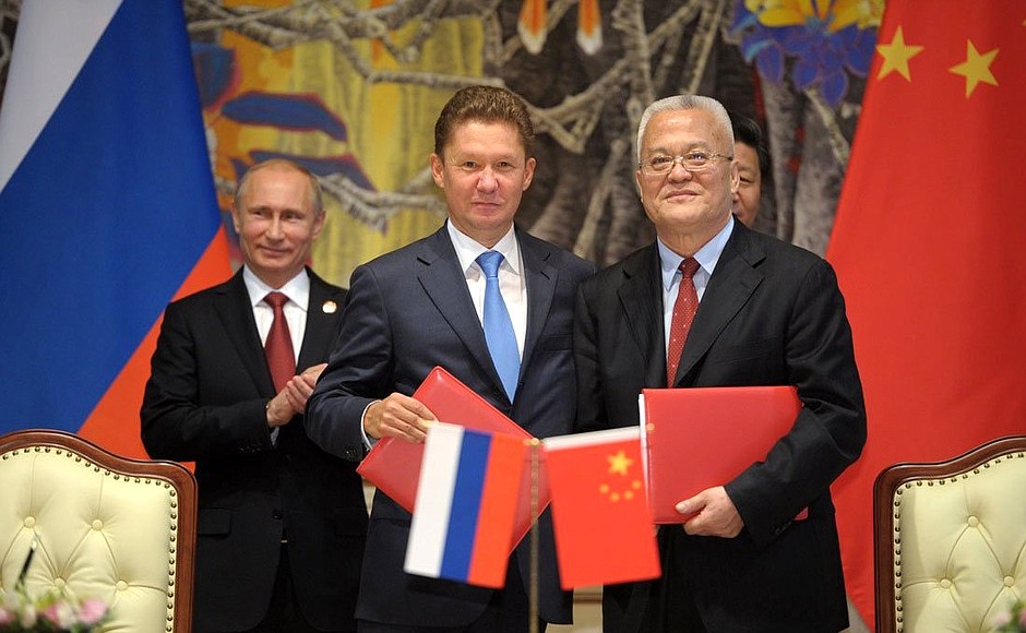 Gazprom CEO Alexei Miller and Russian President Vladimir Putin signing a $400 billion dollar gas deal in 2014 (Kremlin.ru, CC BY 3.0 , via Wikimedia Commons). Source: https://commons.wikimedia.org/wiki/File:Russia_and_China_sign_major_gas_deal.jpeg