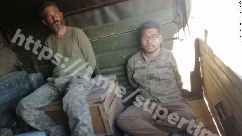 Alexander Drueke and Andy Huynh photographed in the back of what is thought to be a Russian truck (CNN). Source: https://edition.cnn.com/2022/06/16/politics/state-department-american-missing-ukraine/index.html