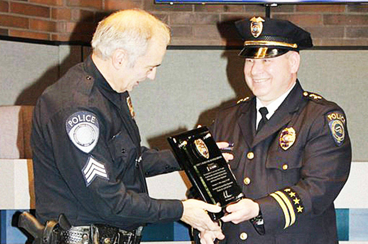 Derek Kammerzell retiring Sgt. Joe Gagner in 2018 (Covington Reporter). Source: https://www.covingtonreporter.com/news/kent-police-assistant-chief-suspended-for-displaying-nazi-insignia/