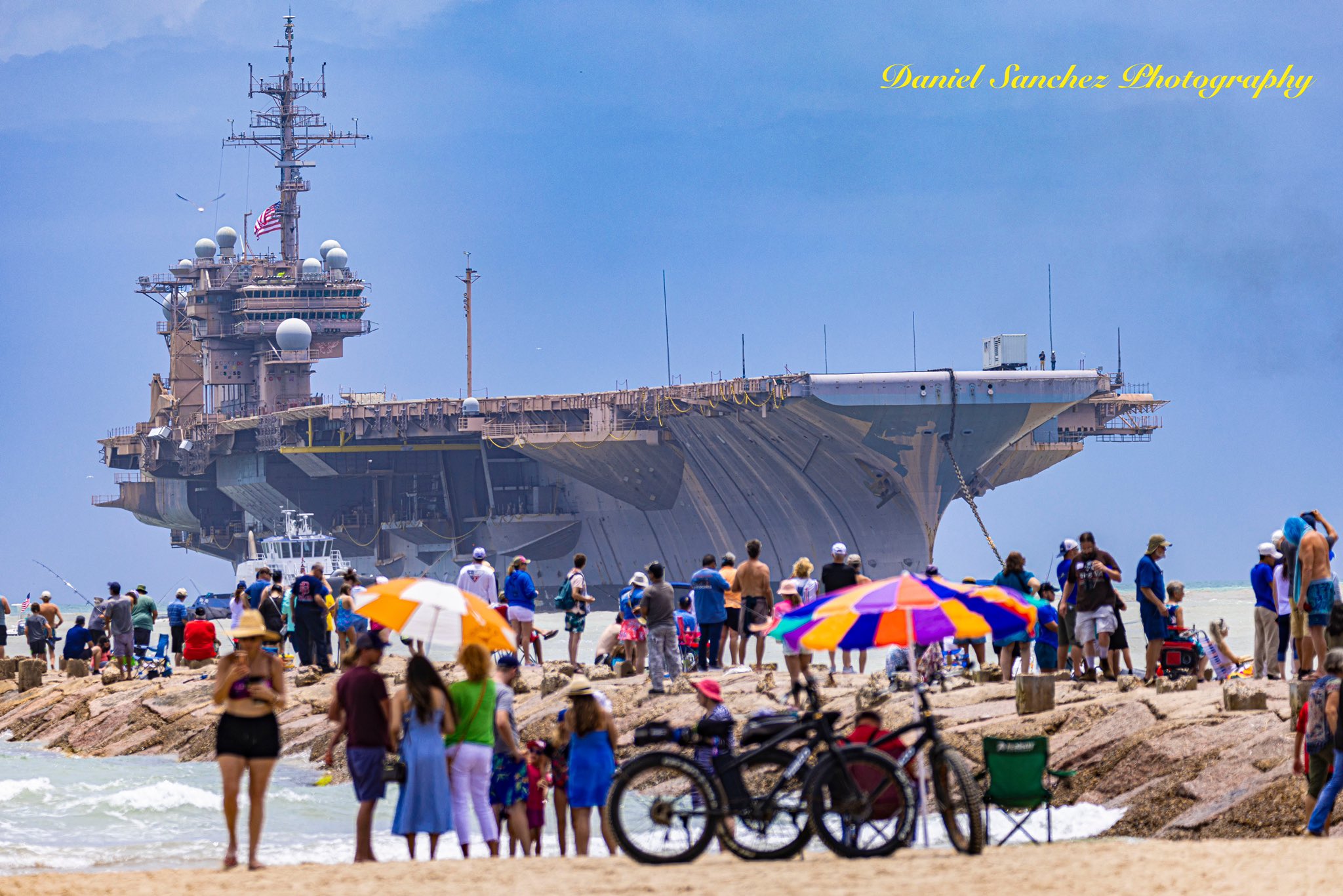 The USS Kitty Hawk making its way through the jetties at South Padre Island toward the port of Brownsville (Daniel Sanchez Photography). Source: https://twitter.com/Daniel_S_Images/status/1531752648432574472