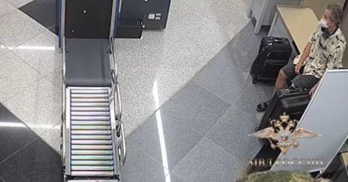 A screenshot from a video released by the Russian government showing Marc Fogel sitting at a security screening area at Russia's Sheremetyevo Airport (Todd Harrison). Source: https://twitter.com/todd_harrison/status/1537836296814698496