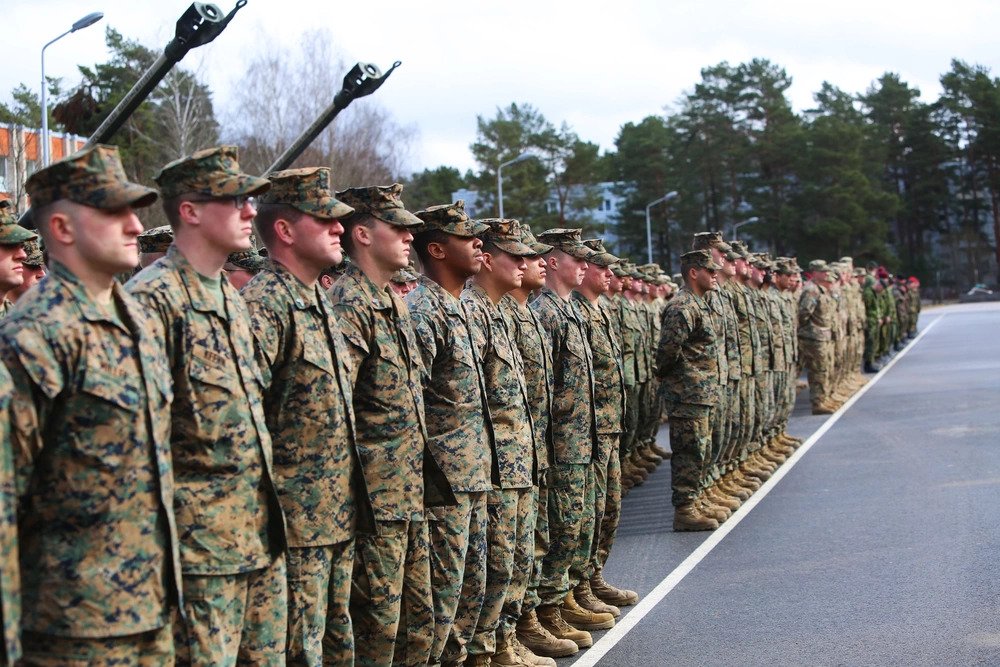 More than 150 U.S. Marines with Black Sea Rotational Force await the closing remarks for Exercise Summer Shield at Adazi Military Base, Latvia, March 31. The U.S. Marines with Black Sea Rotational Force brought the largest amount of Marines to the annual exercise since Summer Shield began in 2004. The Marines conducted small-unit training and combined-arms live-fire exercises with their Allies from Latvia, Lithuania, Luxembourg, Canada, and Germany (DVIDS).
