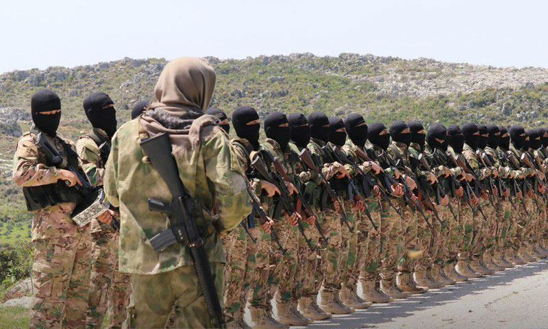 Personnel of the al-Tawhid wal-Jihad Brigade, under Hayat Tahrir al-Sham, rural Idlib – April 2019 (enabbaladi.net). Source: https://english.enabbaladi.net/archives/2019/07/hardliner-wing-of-guardians-of-religion-loses-its-most-influential-figures/ 