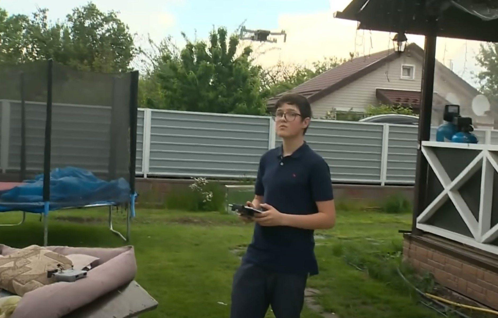 Andriy is shown here flying his drone in his yard.