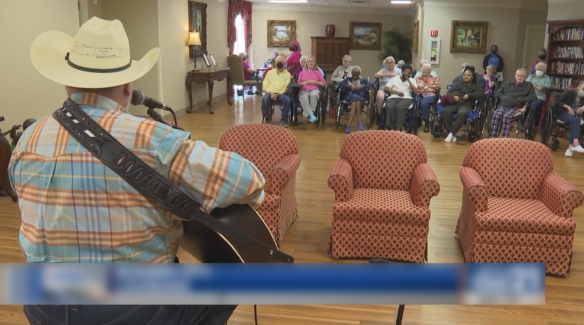 A man entertains seniors in local nursing homes