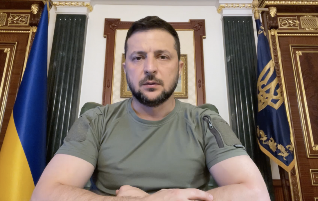 Ukrainian President Zelensky sits behind his desk