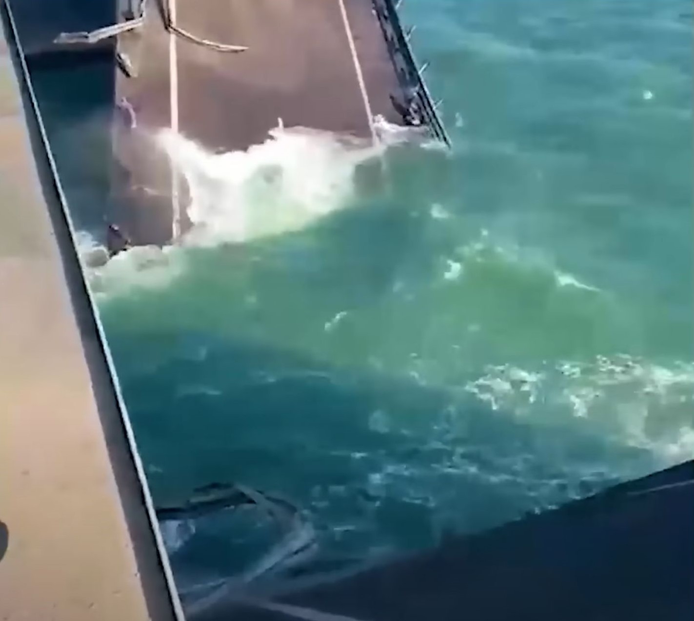 Two sections of the Crimean Bridge are shown in the water