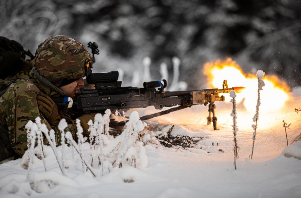 An Alaska Army National Guard Infantryman assigned to Avalanche Company, 1st Battalion, 297th Infantry Regiment, pull security after a fire fight during a training exercise near Joint Base Elmendorf-Richardson Dec. 3, 2022. The exercise was aimed at enhancing the unit’s combat readiness and to evaluate proficiency in an arctic environment. (Army National Guard photo by Spc. Bradford Jackson, 134th Public Affairs Detachment)
