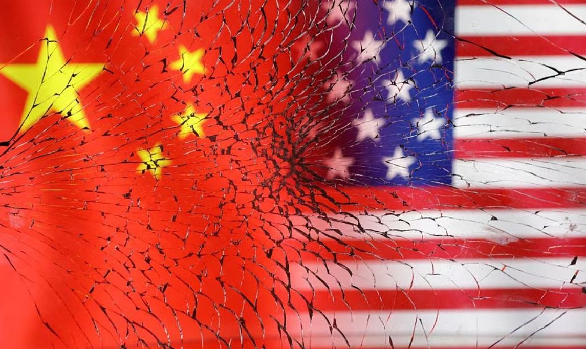 image of US and Chinese flags over broken glass